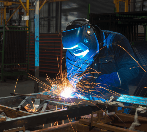 Welder working on metal